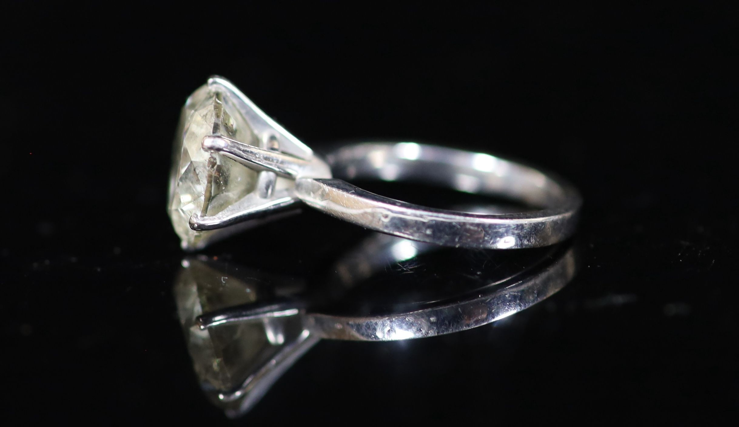 A modern 18ct white gold and solitaire diamond ring